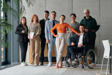 Multiethnic Business Team Collaborating in a Modern Office with Director in a Wheelchair