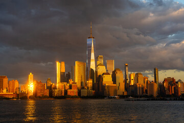 Obraz premium New York City at sunset. NYC cityscape with skyscrapers. Panoramic of New York City skyline. Manhattan skyline. New York and Hudson River. Downtown NYC. New York skyscrapers.