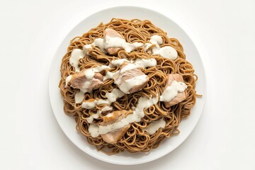 A plate of cooked buckwheat noodles boiled with chunks of chicken and white sauce filling
