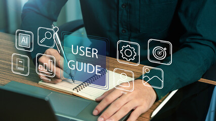 User manual guide concept, Online instruction manual and strategy advice. Businessman using laptop...