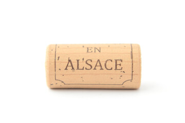 Wine cap or cork pulled from bottle with text in French language "Alsace" closed up isolated on white