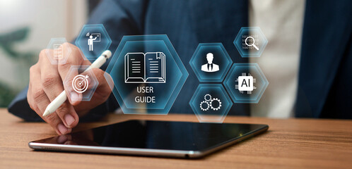 User manual guide concept, Online instruction manual and strategy advice. Businessman using laptop...