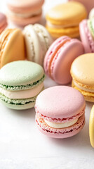 Obraz premium Pastel-colored macarons with a smooth texture and delicate filling, arranged neatly on a white background