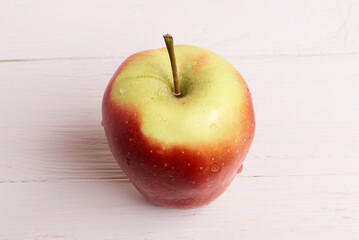 red apple on a wooden table