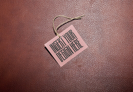 Mockup of a Blank Hang Tag Design on a Textured Background