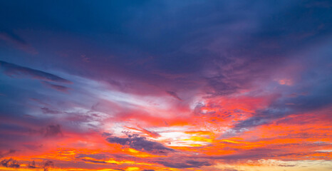 Sky at sunrise. Sunset background. Sunrise through clouds on sky. Twilight sky with sunrise colors. Peaceful dawn with soft light. Dramatic dusk sunrise with clouds. Sunshine in clear sky.