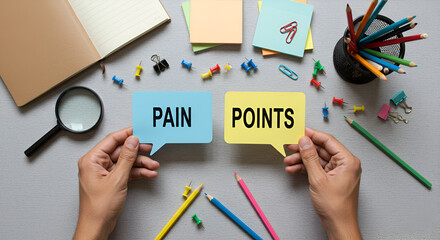 Hands holding 'PAIN' and 'POINTS,Business pain point and marketing concepts.