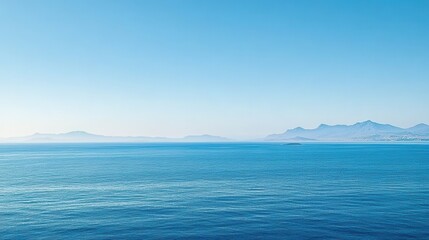 Serene Seascape with Distant Mountains