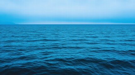 Fototapeta premium Serene Blue Ocean Waves Under Soft Morning Light Horizon