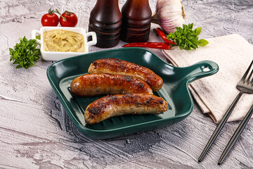 Delicous natural roasted sausages in the plate