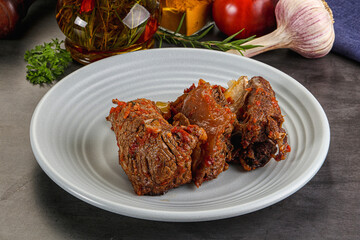 Baked beef ribs with vegetables
