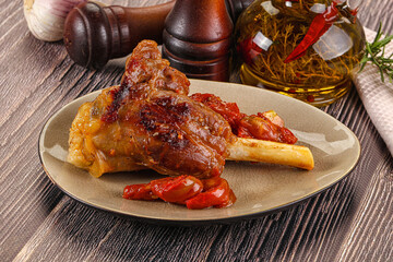 Baked lamb shank with vegetables