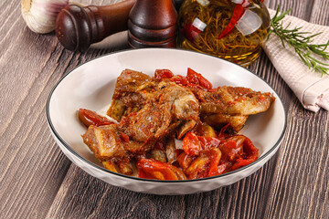 Baked lamb ribs with vegetables