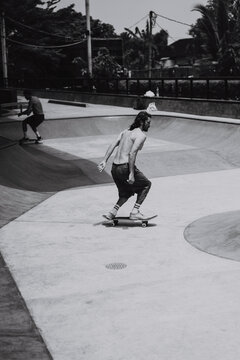 Young men skateboarding in skate park, Canggu, Bali, Indonesia