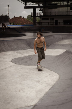 Young men skateboarding in skate park, Canggu, Bali, Indonesia