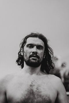 Black and white portrait of young man in skate park