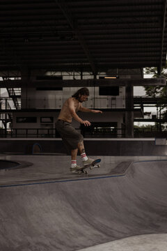 Young men skateboarding in skate park, Canggu, Bali, Indonesia