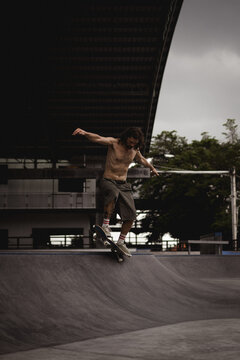Young men skateboarding in skate park, Canggu, Bali, Indonesia