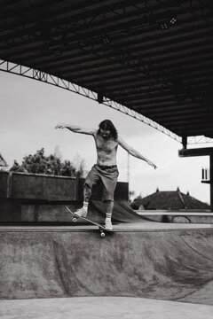 Young men skateboarding in skate park, Canggu, Bali, Indonesia