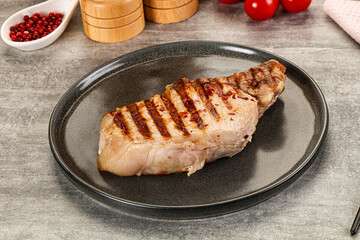Grilled pork loin steak with bone