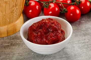 Red tomato paste in the bowl