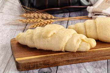 Raw uncooked croissant for bake