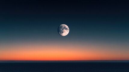 Obraz premium Full Moon Over the Ocean at Sunset