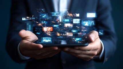Fototapeta premium Hand of businessman holding smartphone in gray city with many business themed pictures emerging from it. Concept of hi tech and big data. Toned image double exposure