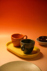 ceramic cups and dishes in artistic photography style