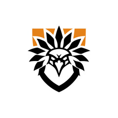 Obraz premium Black and Orange Tribal Bird in Shield for Team Logo, black, orange, tribal, bird, shield, team, logo, emblem, design, graphic, hawk, eagle, falcon, symbol, fierce, bold, strong, powerful, athletic