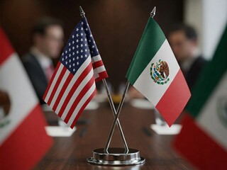 United States and Mexico flags crossed on a table at an international diplomatic meeting. The scene represents cooperation, negotiations, foreign relations, and global diplomacy in a formal setting