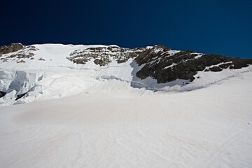 View of the 4,107 meter high Monch mountain from Jungfraufirn in the Bernese Alps. Switzerland....
