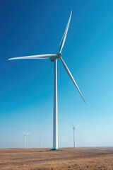 Fototapeta premium field of towering wind turbines stretches across dry plains beneath a clear blue sky, symbolizing clean energy, sustainability, and environmental progress