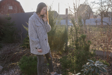 Woman using phone outdoors