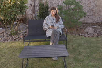 Fototapeta premium Woman using phone outdoors