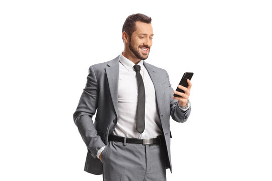 Professional man in a suit standing and looking at a smartphone - Powered by Adobe