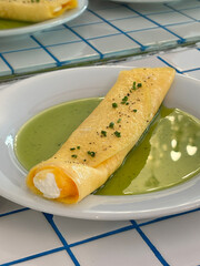 Delicate Omelette Roll with Cream Filling and Green Sauce

