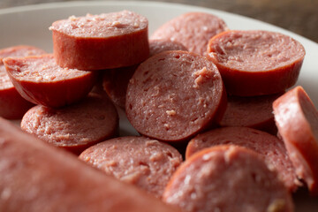 A closeup view of a hot dog slices.