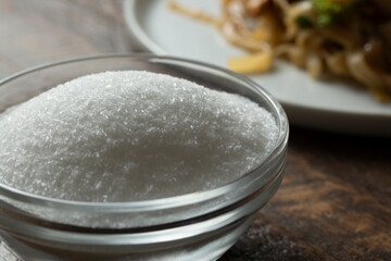 A closeup view of a small bowl of MSG.