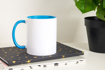 Blue Handle Blank Lifestyle 11oz Mug Mock Up With Monstera Plant