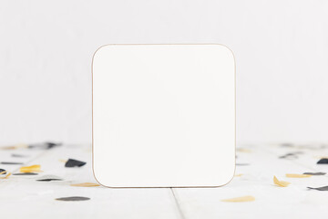 White Coaster Mock Up Themed for Celebrations and Graduation With Gold and Black Confetti