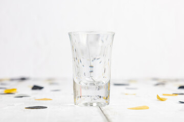 Shot Glass Mock Up Themed For Celebrations and Graduation With Black and Gold Confetti