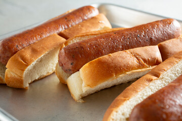 A view of a tray of turkey sausage hot dogs.