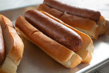 A view of a tray of turkey sausage hot dogs.