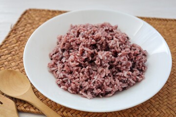 Cooked riceberry in white plate,riceberry it is a very useful rice,