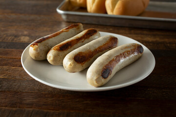 A view of some bratwurst on a plate.