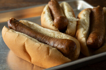 A view of three hot dogs, featuring chicken sausage.