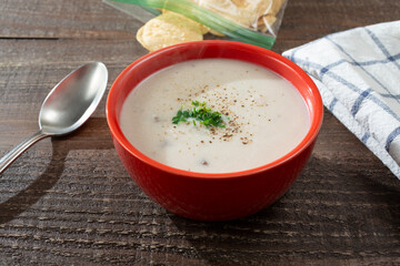 A view of a bowl of cream of mushroom soup.