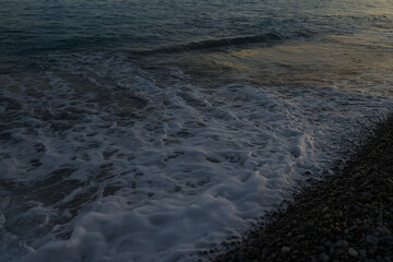 Sunset on the French Riviera pebble beach in Nice