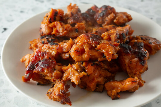 A closeup view of a plate of chicken tocino.